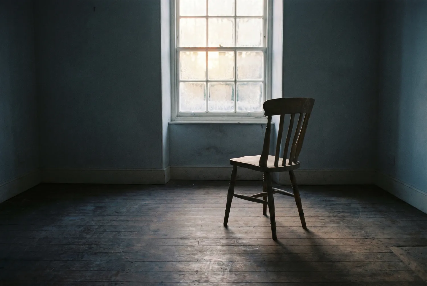 Low winter morning light through a frosted window into a quiet room Low winter morning light through a frosted window into a quiet room