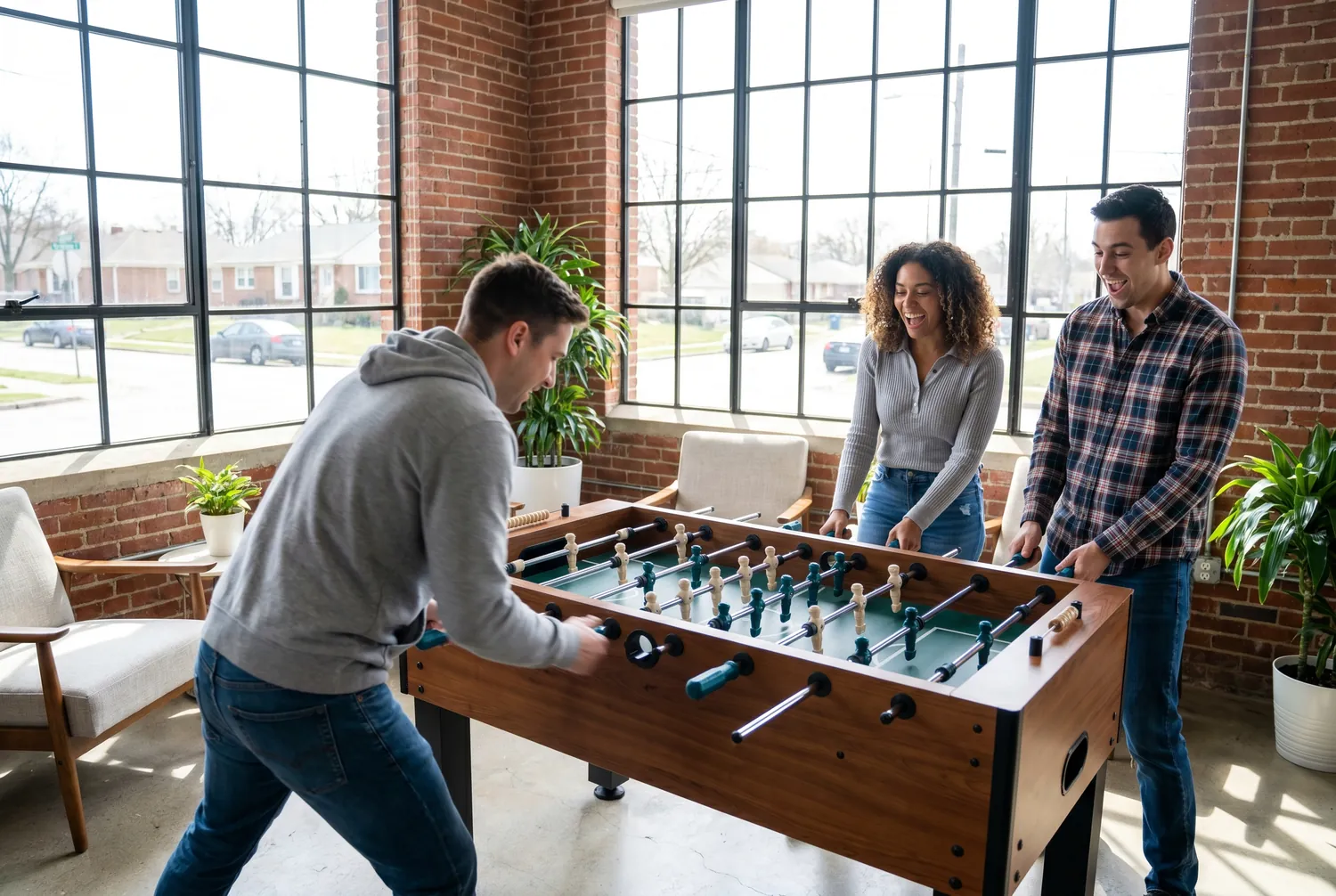 Foosball match in a modern Fishers office lounge Foosball match in a modern Fishers office lounge