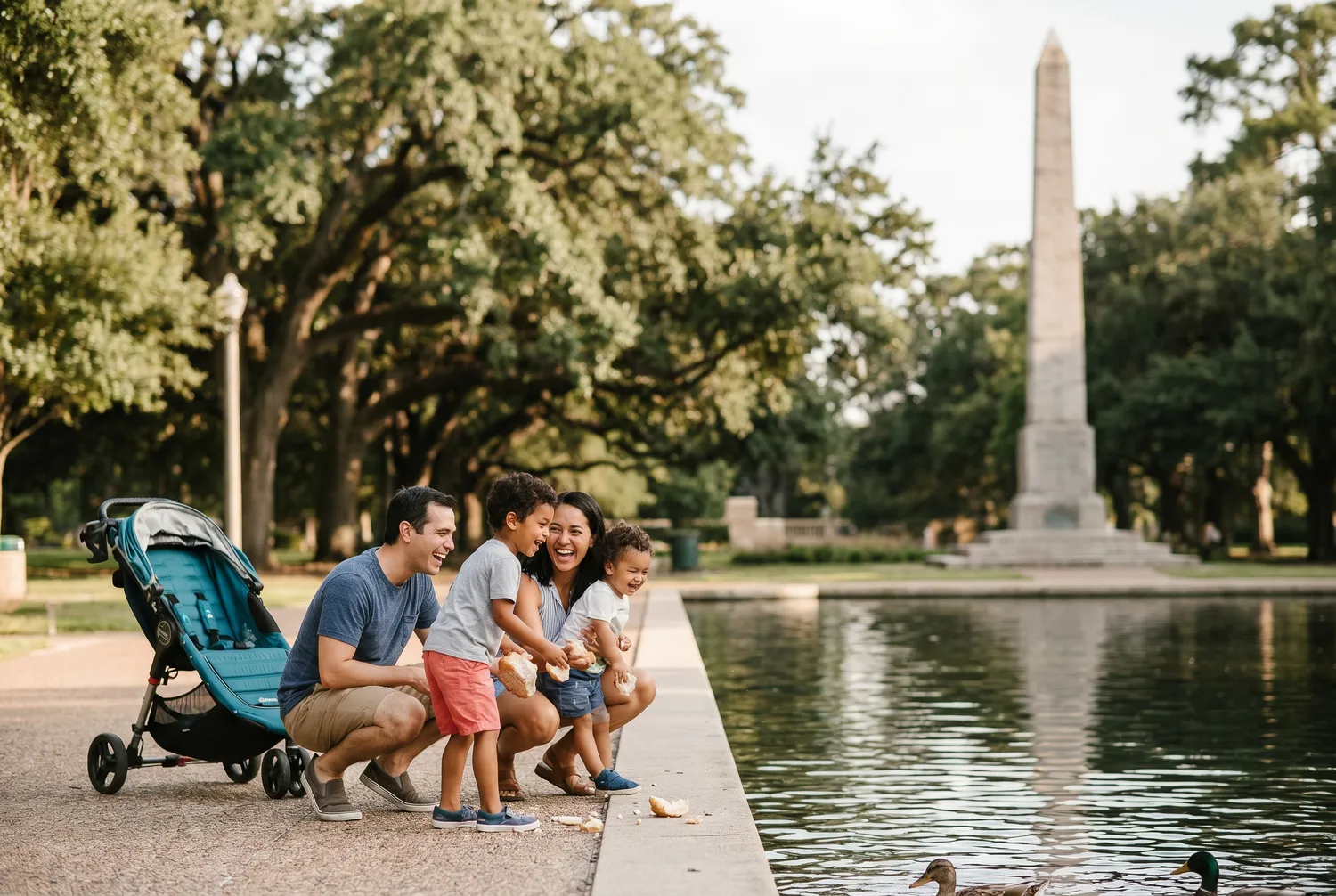 Family strolling the reflection pool at Hermann Park in Houston