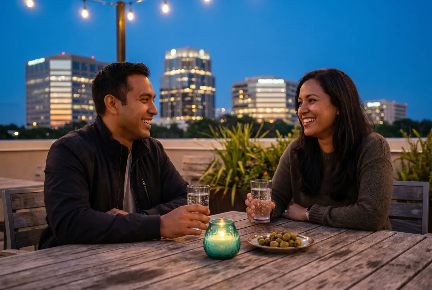 Rooftop conversation at dusk over the Sandy Springs Perimeter skyline Rooftop conversation at dusk over the Sandy Springs Perimeter skyline